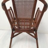 Rattan armchair with its footrest 70s