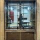 Early 20th-century shop display cabinet in oak with sliding doors.