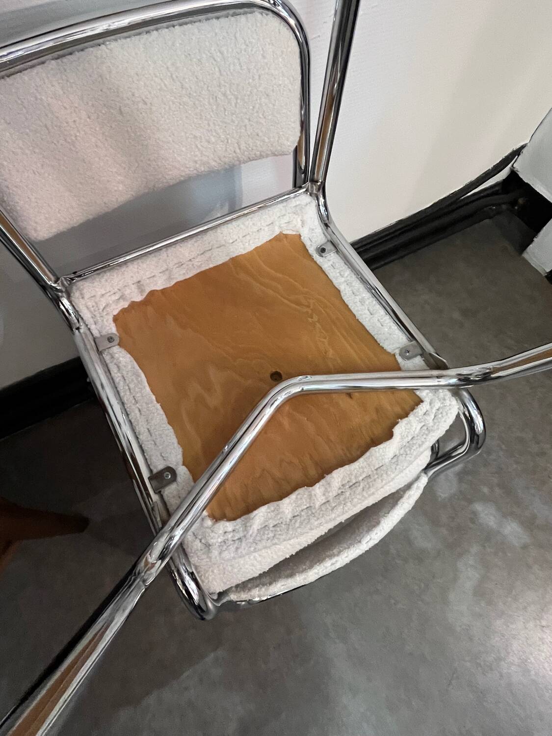 Pair of chrome chairs upholstered in boucle fabric.