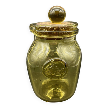 Yellow bubbled glass apothecary jar with cork lid.