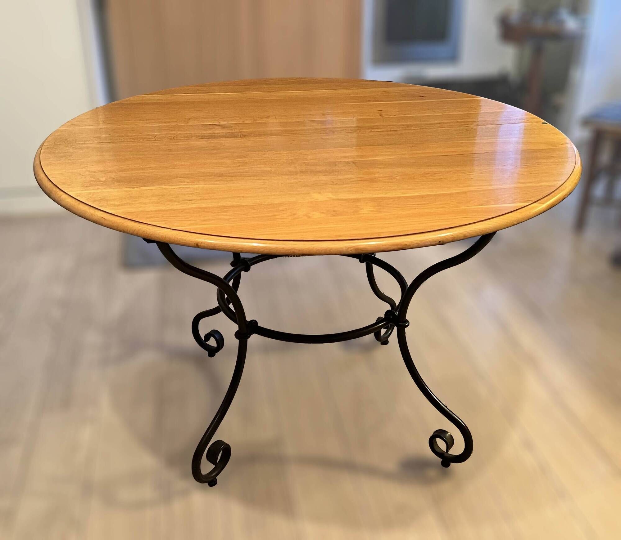 Extendable table in solid oak with wrought iron legs.