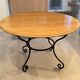 Extendable table in solid oak with wrought iron legs.