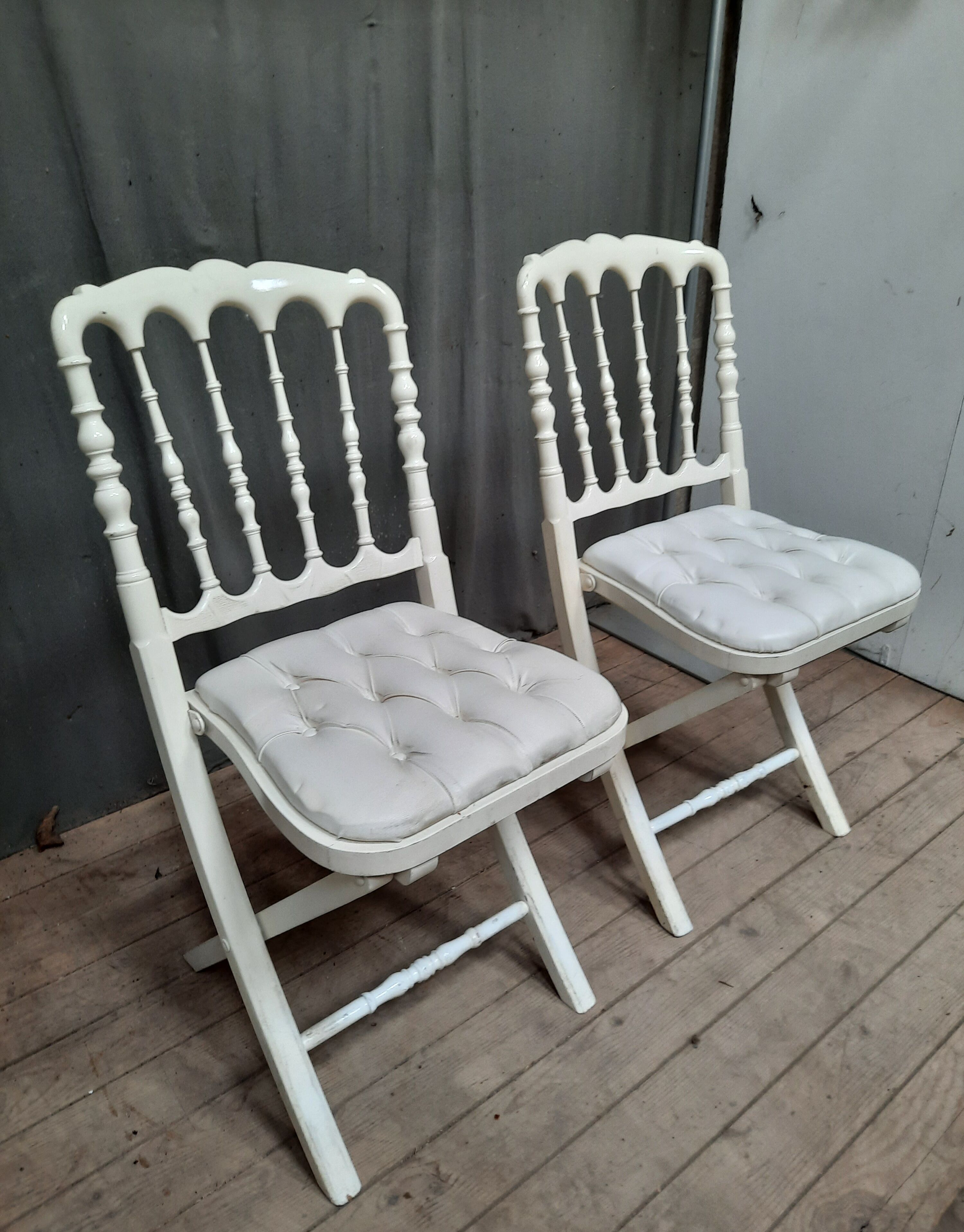 Pair of upholstered folding chairs