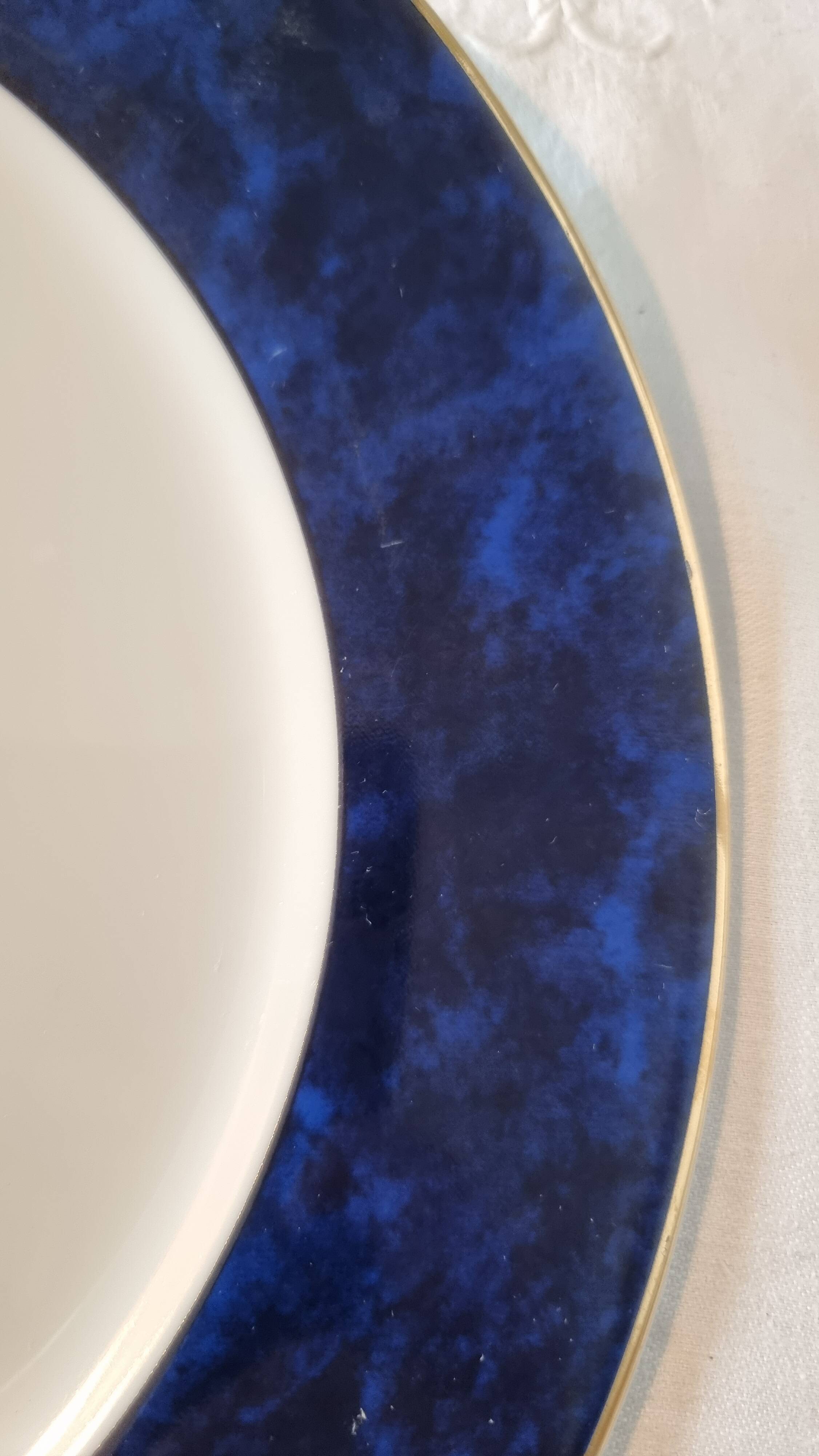 18-piece porcelain dinnerware set from Limoges by Philippe Deshoulières.