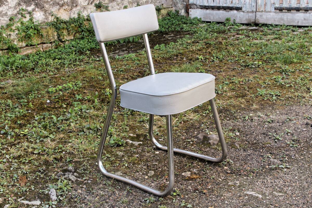 Set of 2 chairs and 1 armchair from the 70s in chrome metal and faux leather.
