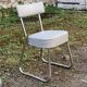 Set of 2 chairs and 1 armchair from the 70s in chrome metal and faux leather.