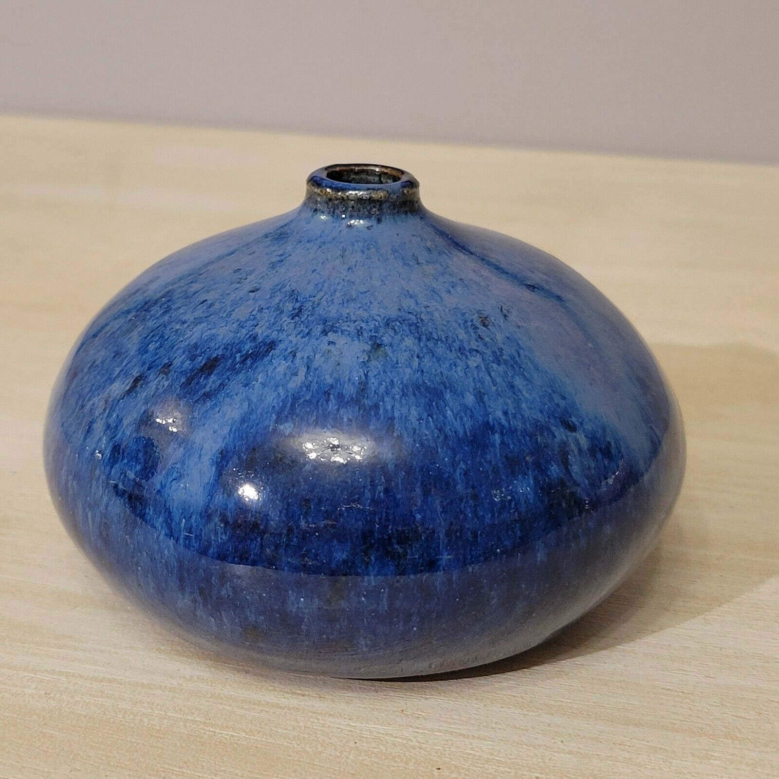 Small blue enamelled ceramic ball vase