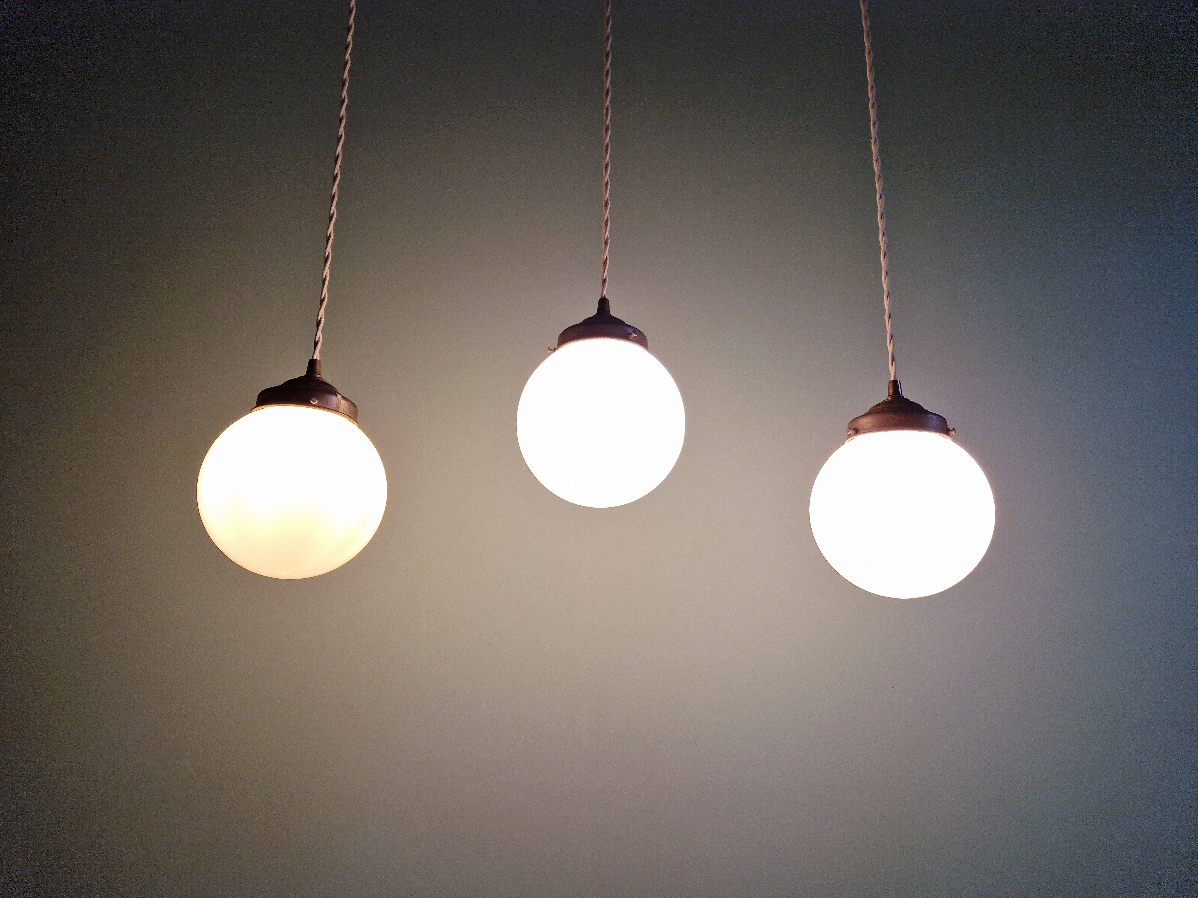 Art Deco trio of suspensions in white opaline, 1930s