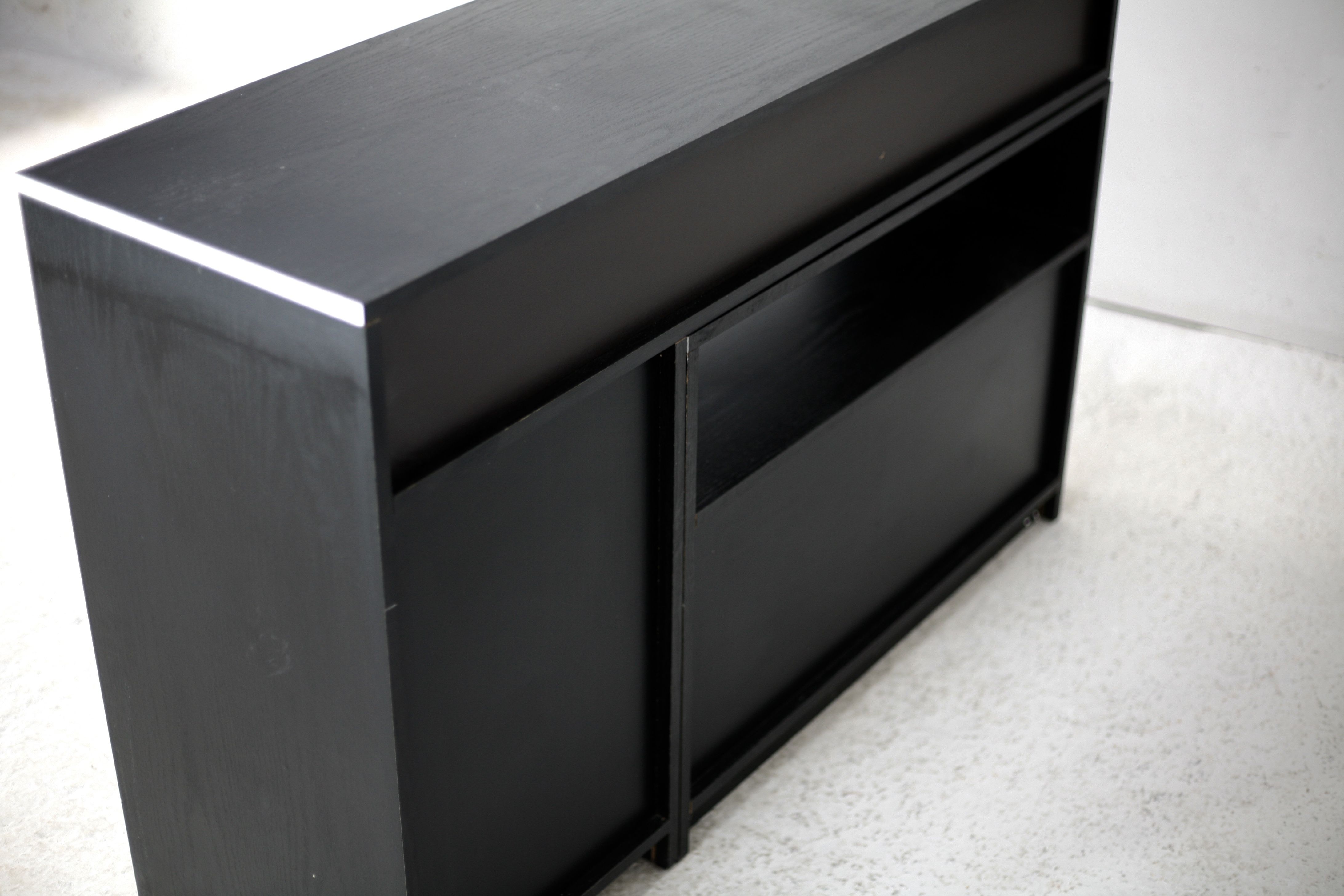 Storage cabinet wood compressed lacquered black lining margins aluminum. France, circa 1975.