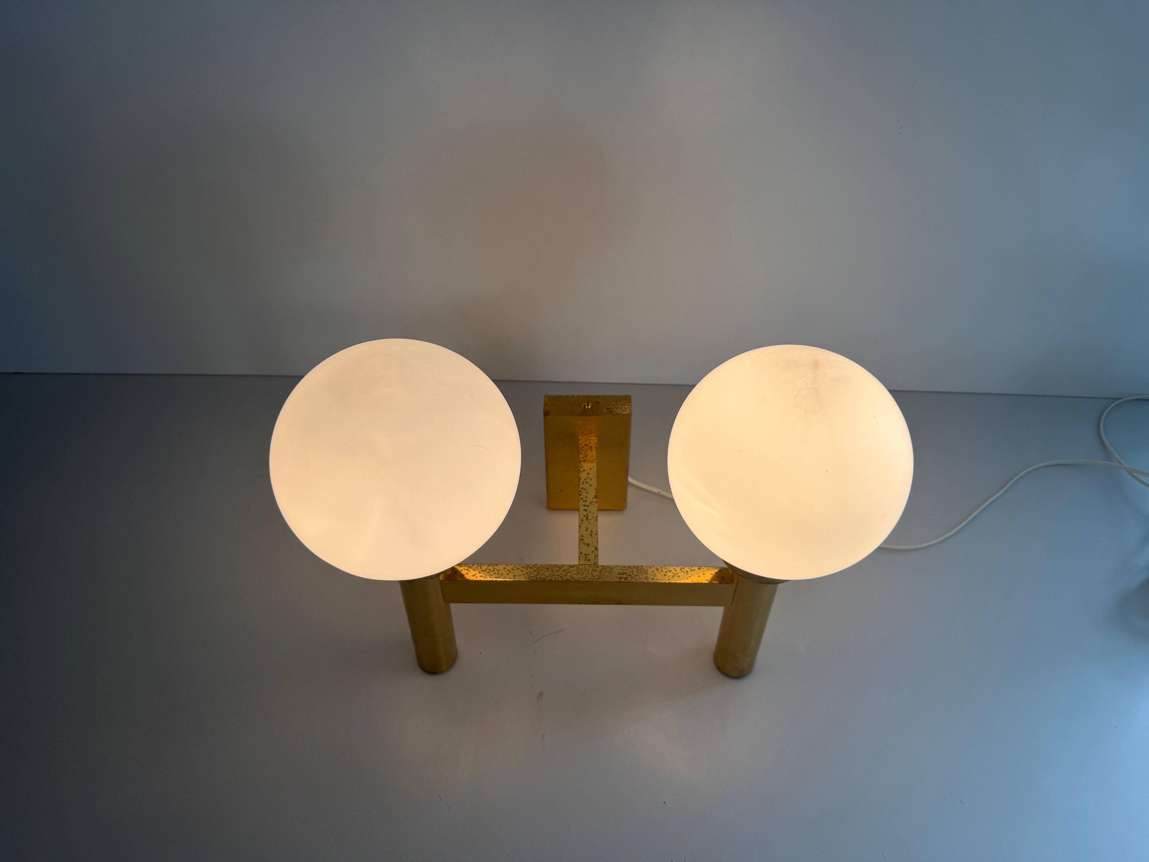 Double opal glass and heavy brass, large minimalist cinema wall light, 1960s, Germany