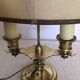 Old golden brass hot water bottle lamp with 2 arms of light
