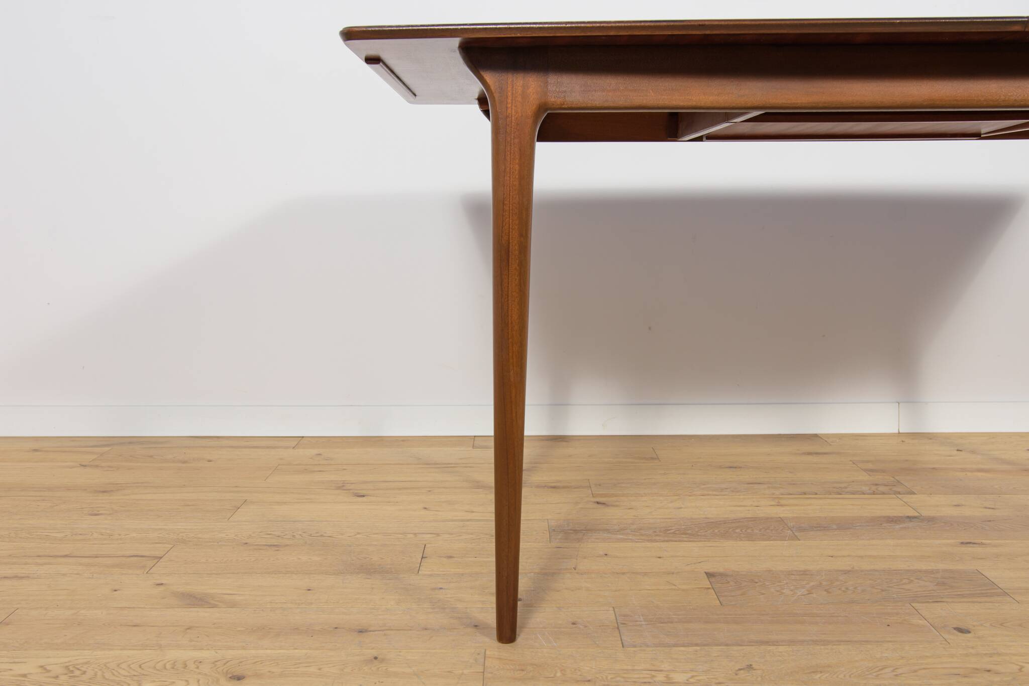Extendable teak dining table in Mid-Century style from McIntosh, UK.