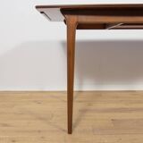 Extendable teak dining table in Mid-Century style from McIntosh, UK.