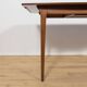 Extendable teak dining table in Mid-Century style from McIntosh, UK.