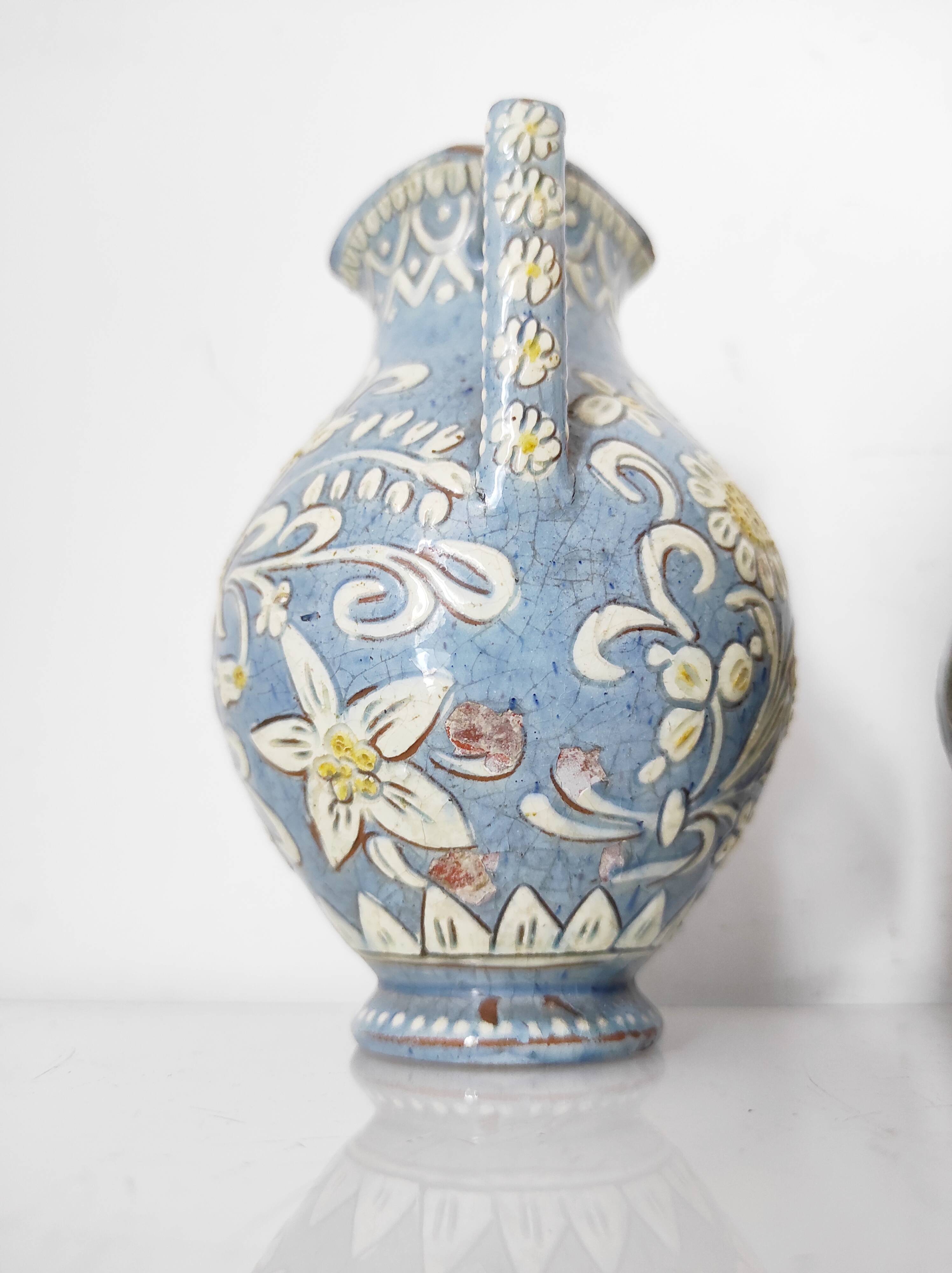 Two small blue ceramic vases