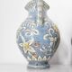 Two small blue ceramic vases
