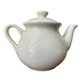 Small light beige earthenware teapot