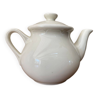 Small light beige earthenware teapot