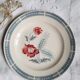 Old flat plates mismatched in earthenware