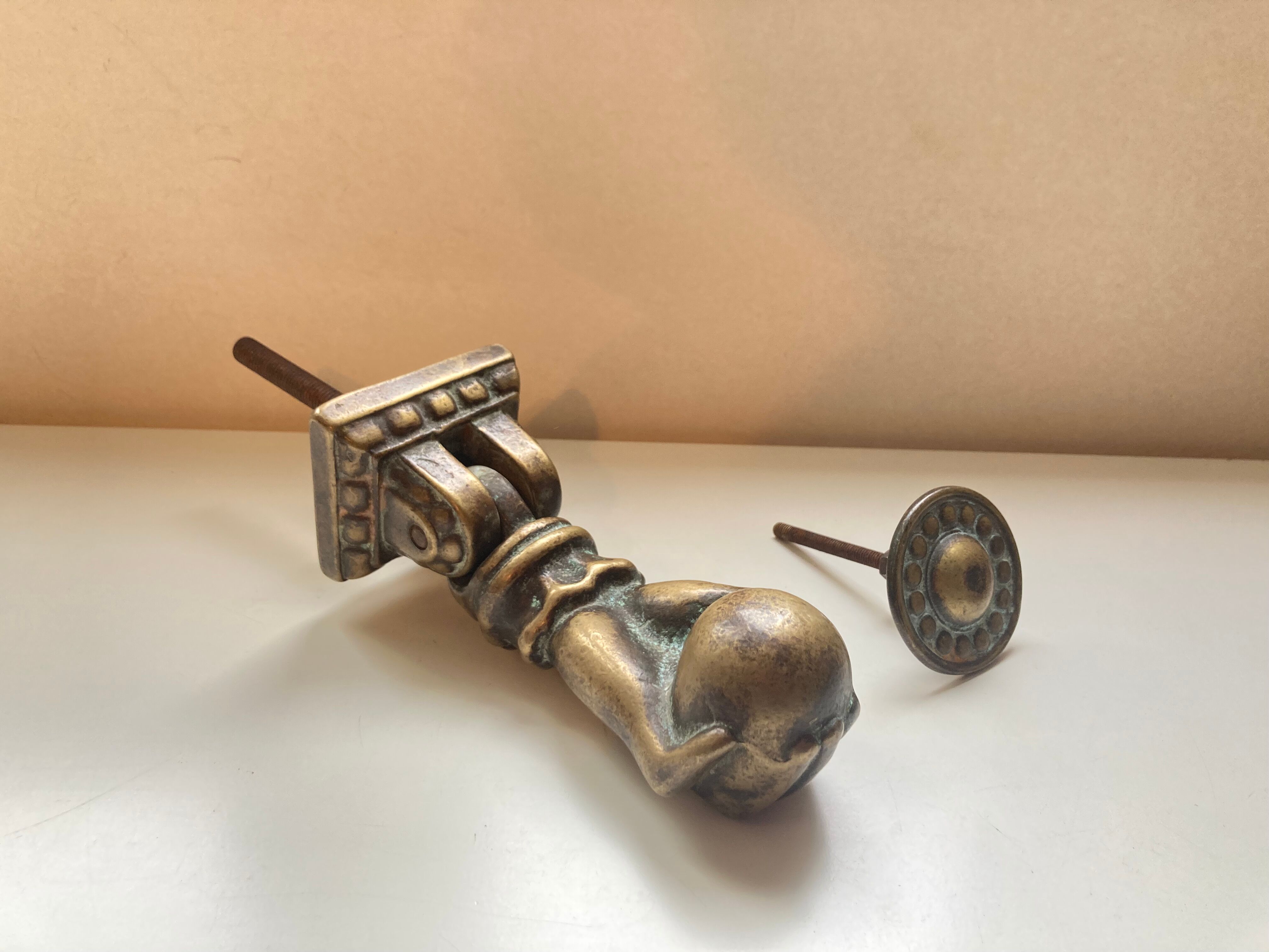 Antique bronze hand-shaped door knocker