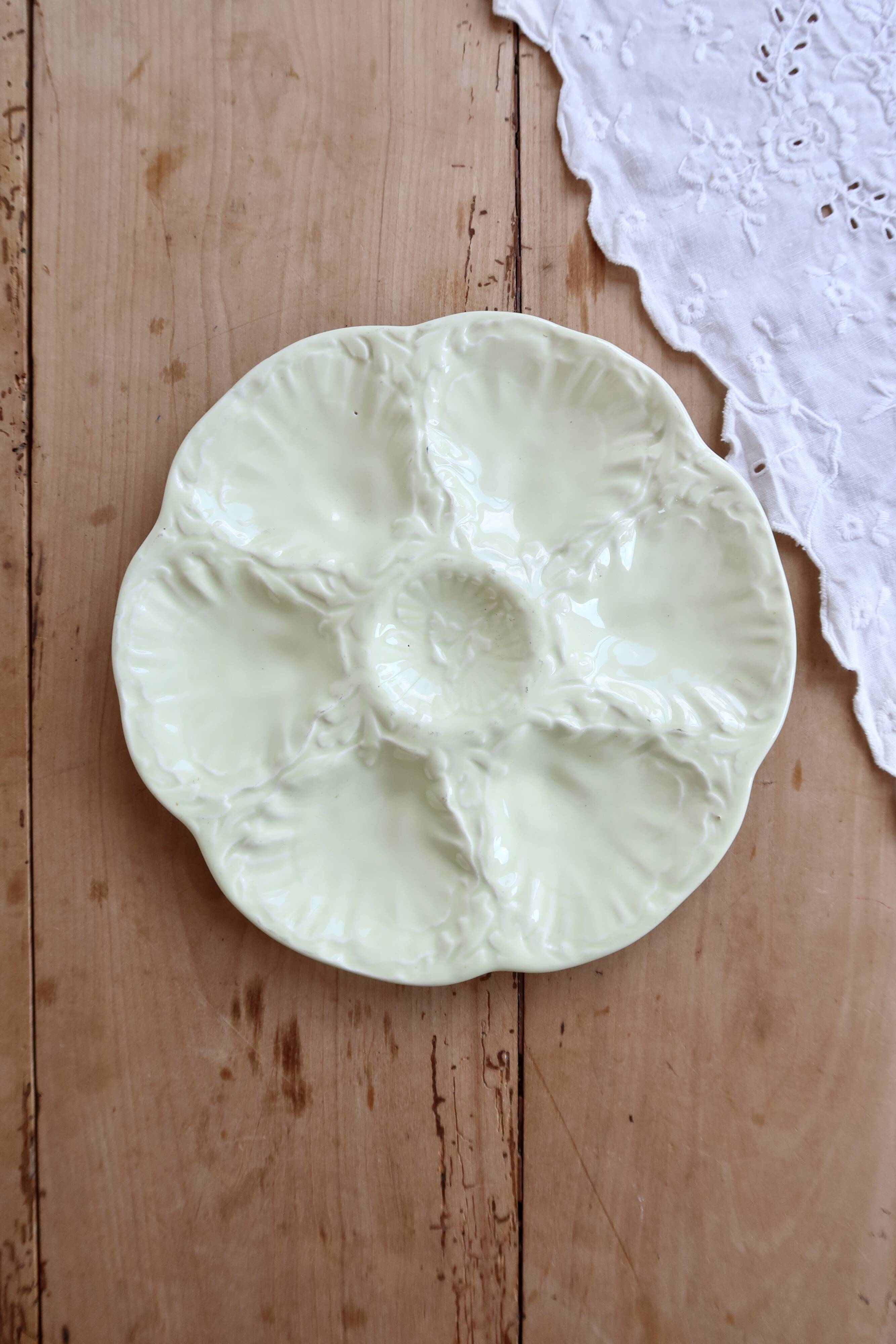 Vintage Gien oyster plate in almond green earthenware.