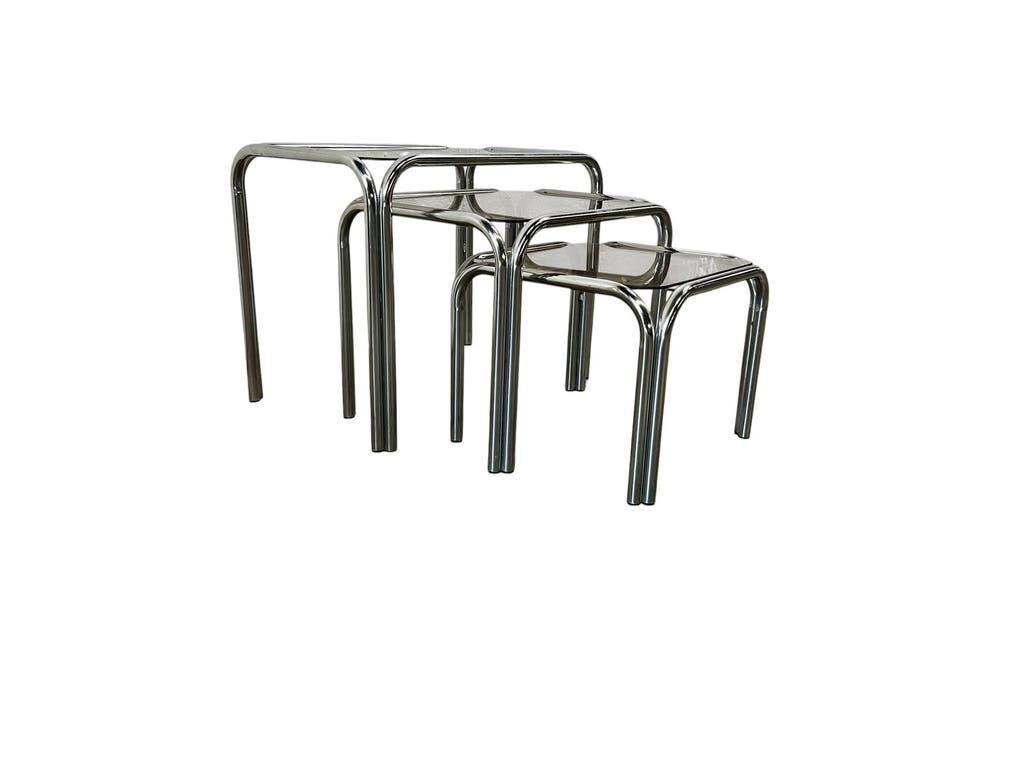 Set of 3 vintage chrome nesting tables with smoked glass.