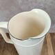 Large antique jug from Sarreguemines with golden trim.
