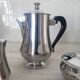 Rémy Letang / Teapot, milk jug and sugar bowl in 18/10 stainless steel and Bakelite