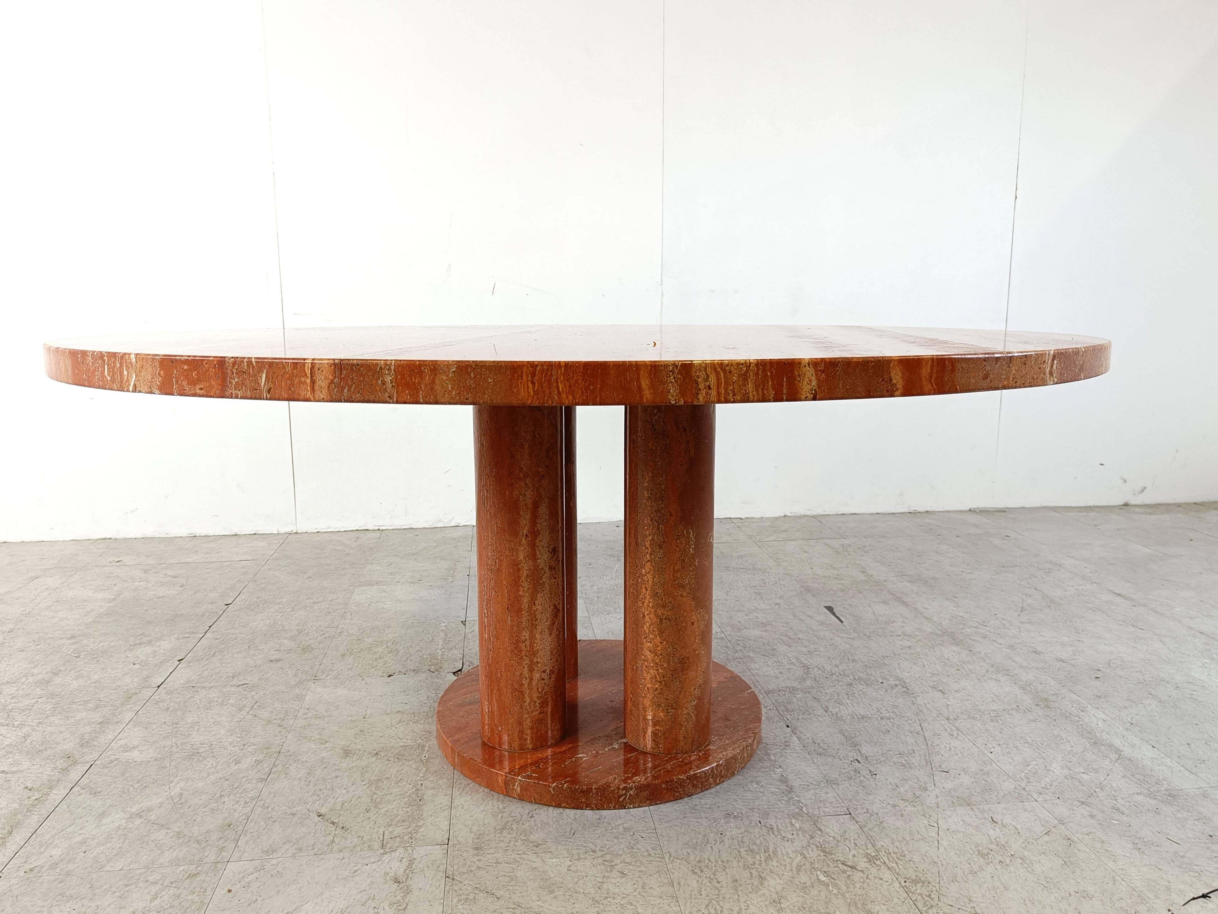 Large round red travertine dining table, 1970s