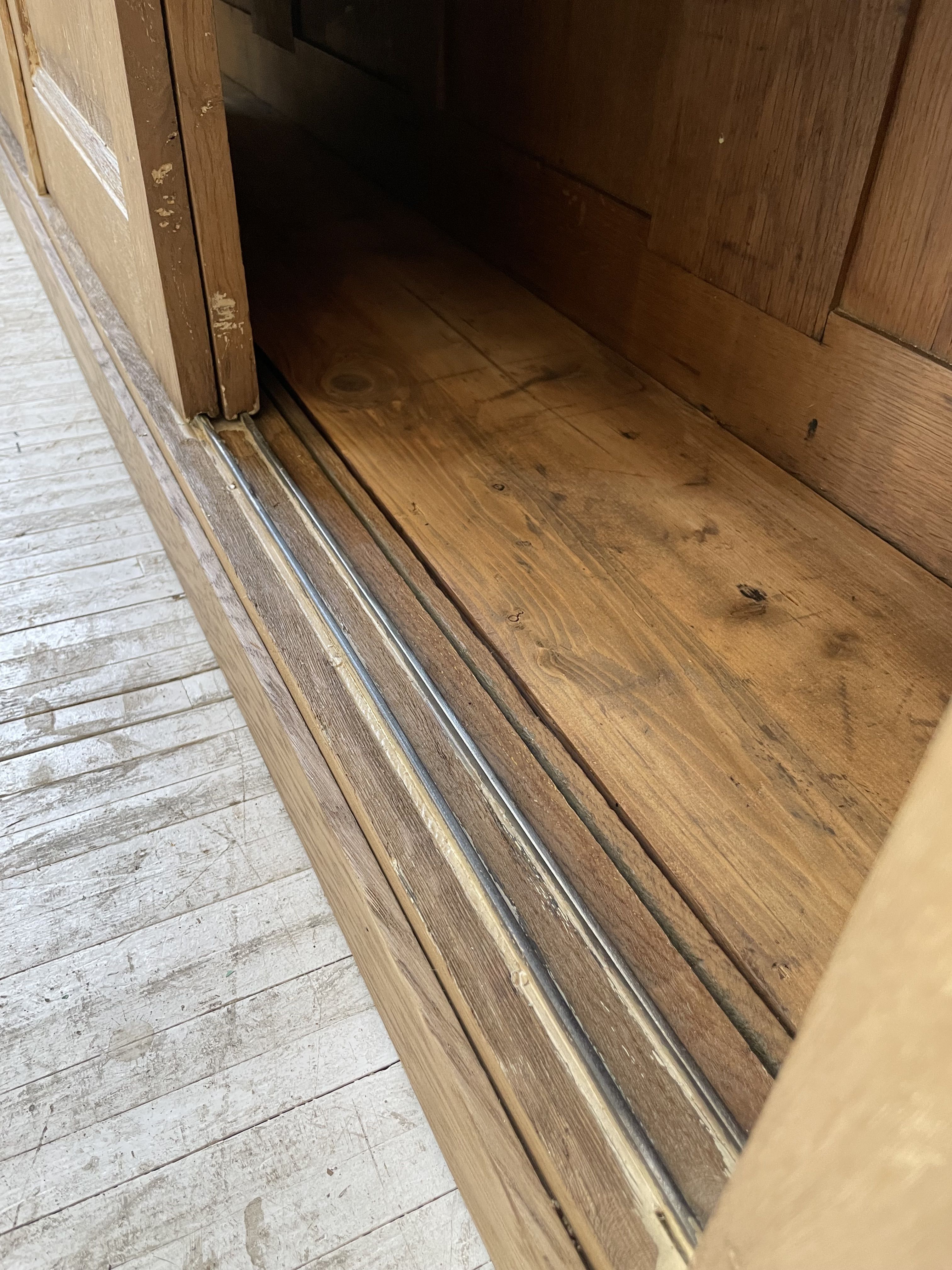 Large row of solid oak loom sliding doors