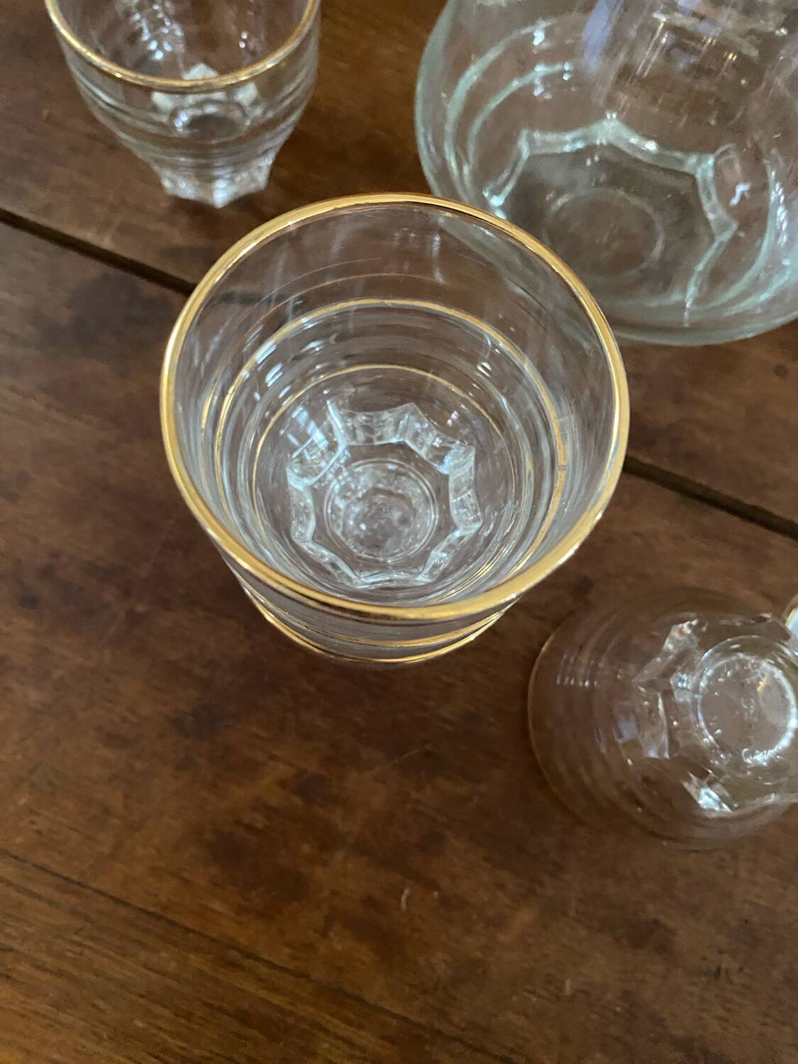 9 vintage gold rimmed glasses.