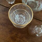 9 vintage gold rimmed glasses.