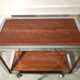 Italian rolling dessert table with two trays decorated with pink travertine
