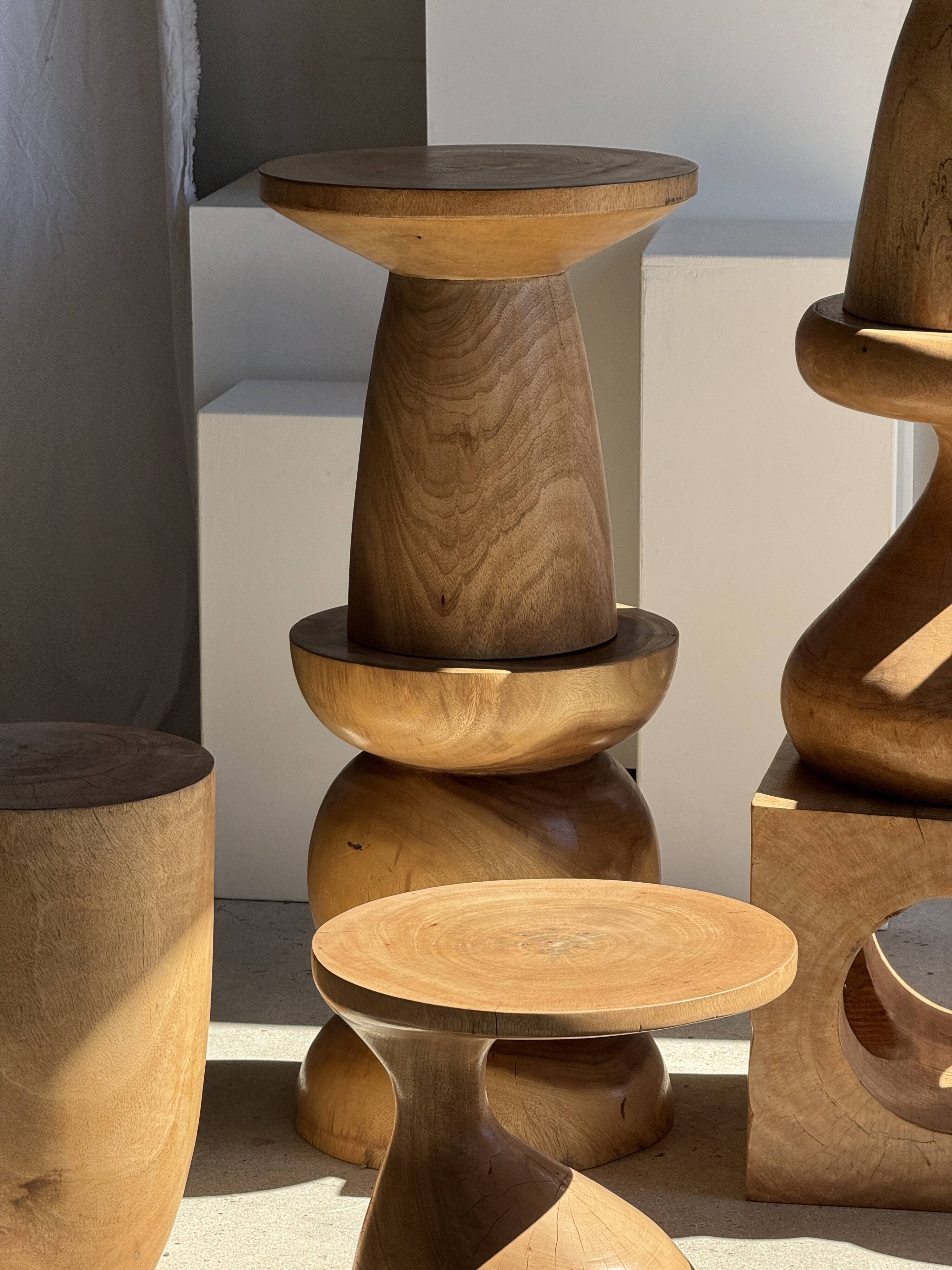 Natural solid mango side table (monoxyle) with conical legs.