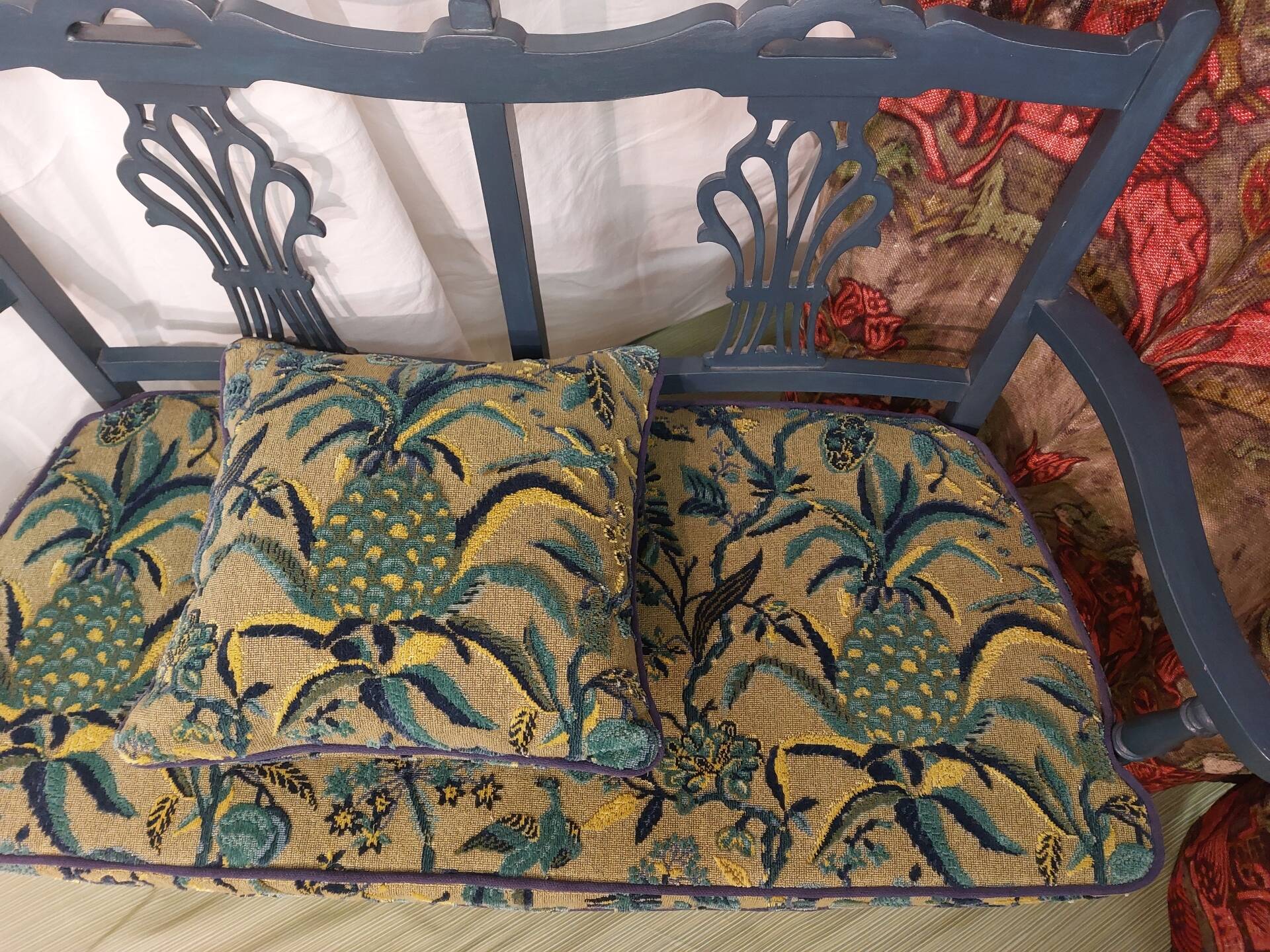 Pretty painted and upholstered bench in green and blue.