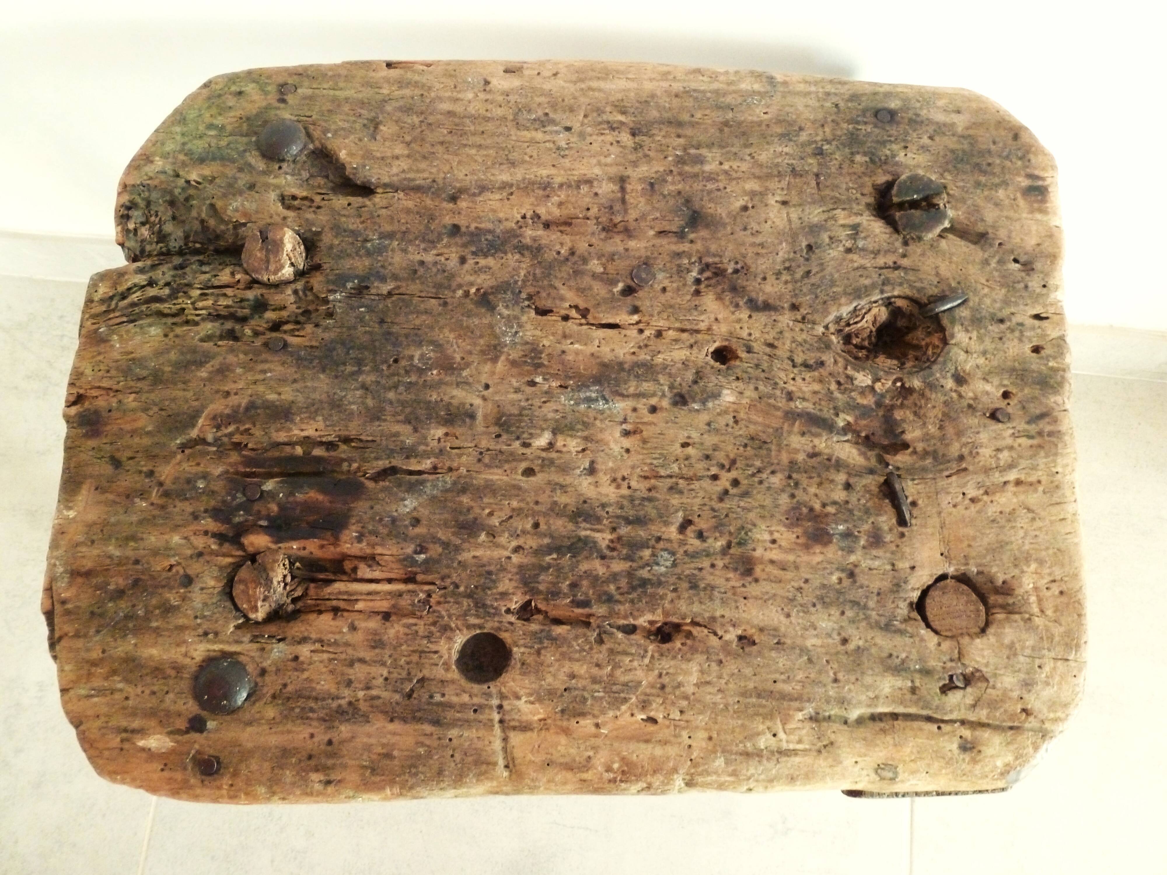 Old milking stool, old farm stool, primitive art.