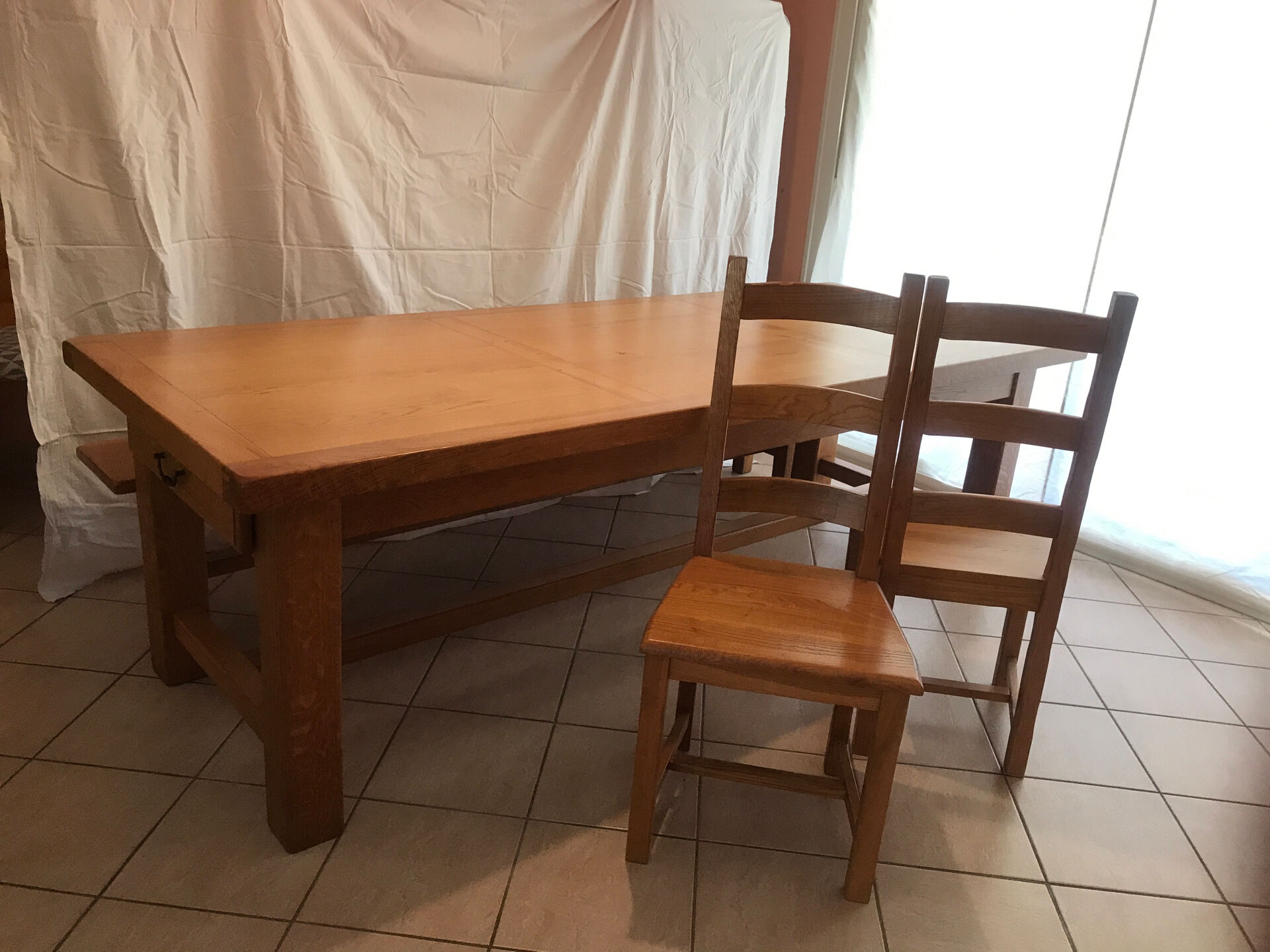 Solid oak dining table made by a craftsman cabinetmaker.