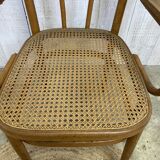Curved wood and cane armchair