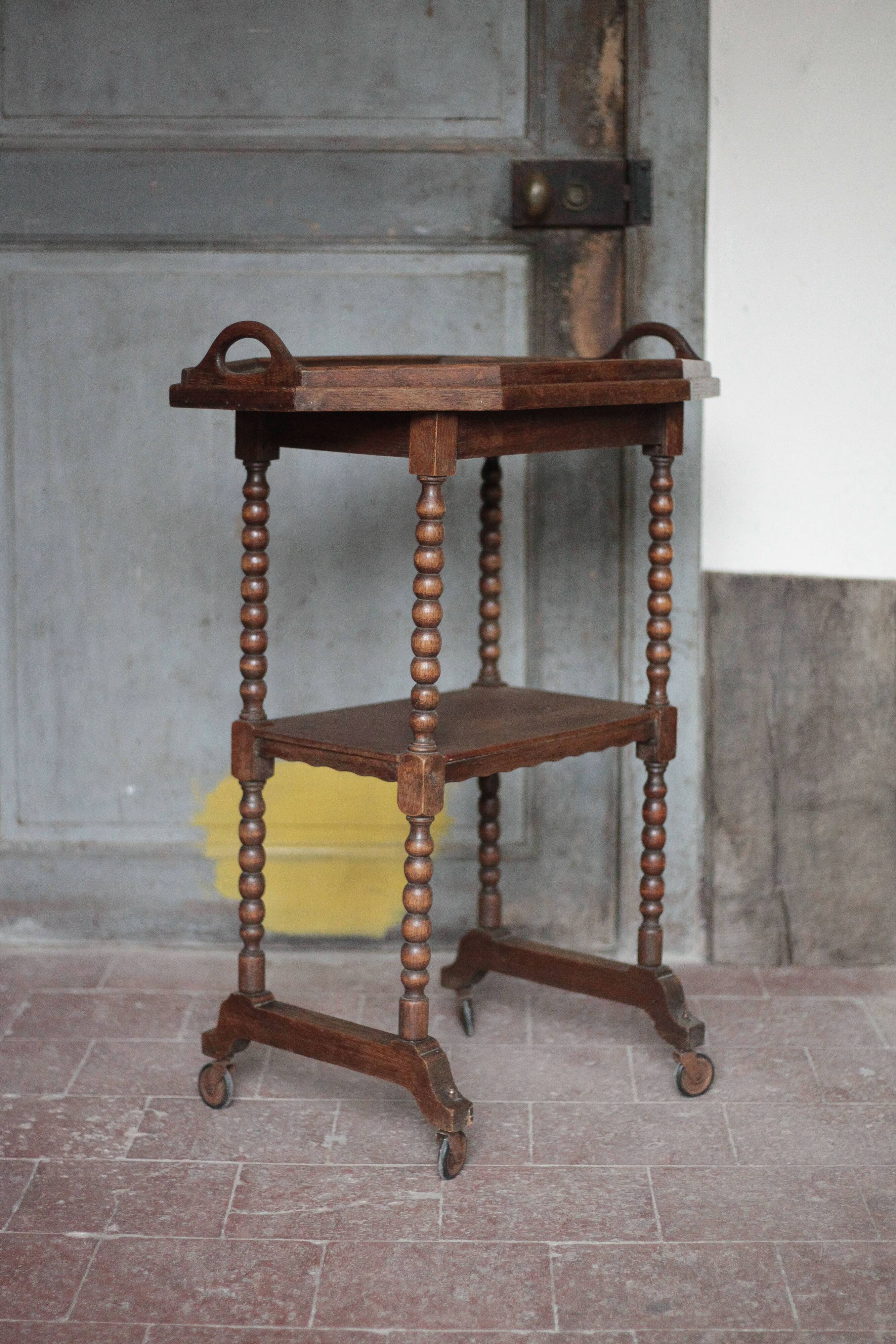 Vintage turned wood dessert trolley, wheeled table with removable top.
