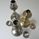 three brass and chrome candle holders early twentieth century