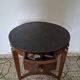 Empire guéridon table in mahogany with a black marble top and gilded bronze.