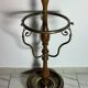 Umbrella stand and English-style wooden and brass canes, 20th century.