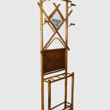 Art nouveau bamboo coat rack with beveled mirror. 5 coat hooks, umbrella stand.