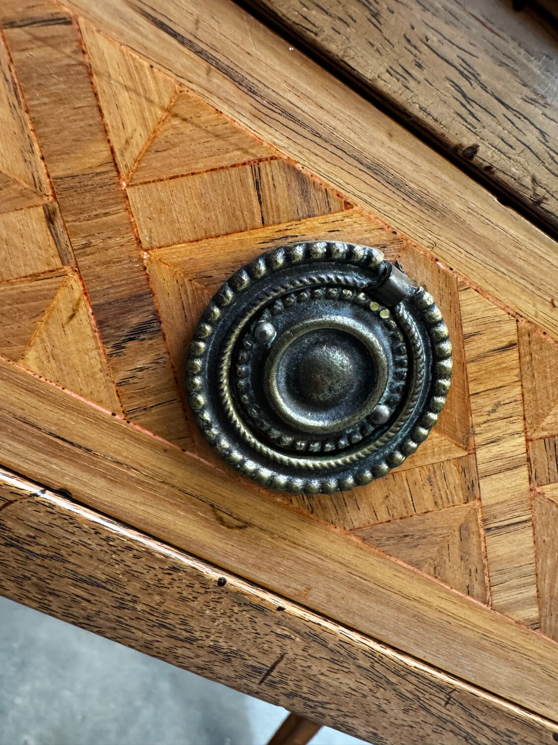 Cylinder desk with marquetry featuring a crosshatch design.