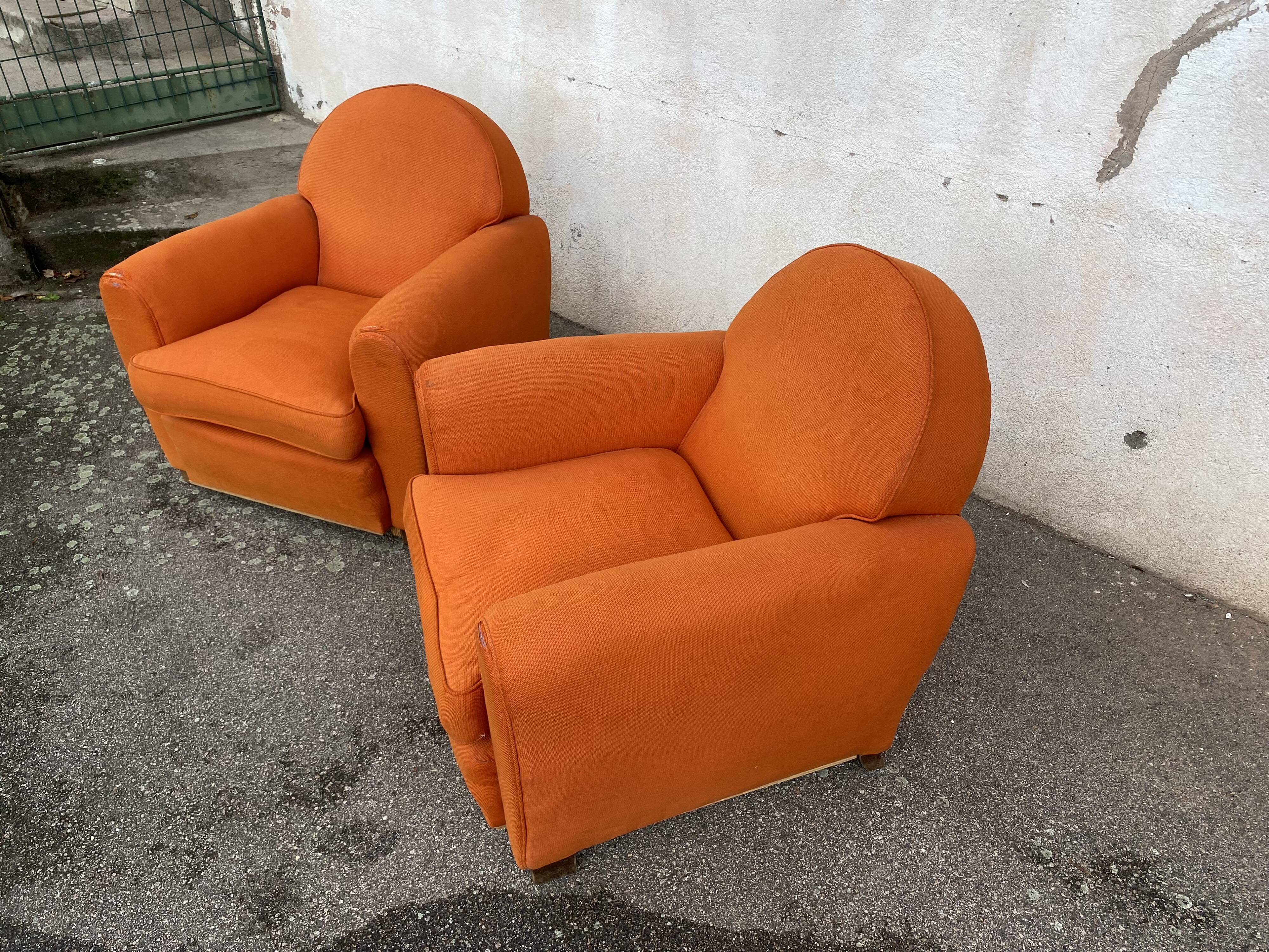 Pair of vintage orange club chairs