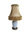 Small vintage lamp in white porcelain with a star pattern and fringed shade.