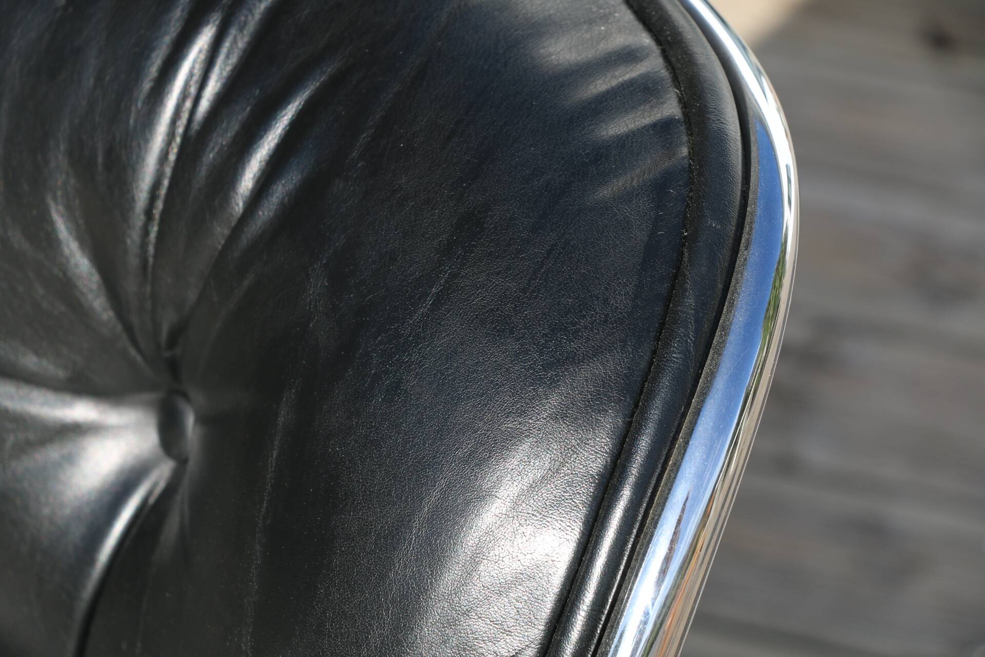 POLLOCK black leather reclining armchair with casters
