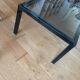 Smoked glass coffee table with chrome metal.