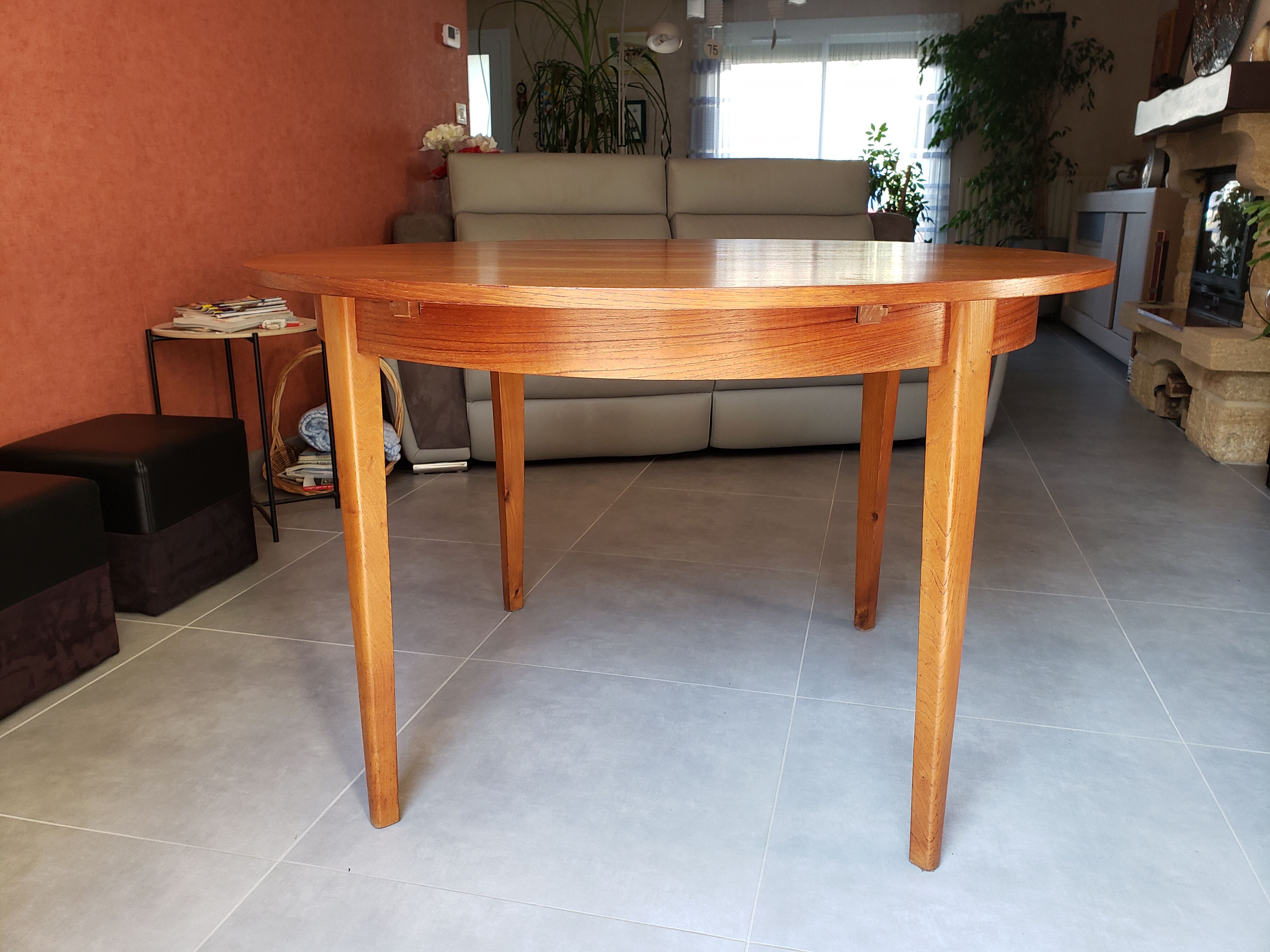 Round extendable teak dining table from the 60s