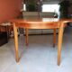 Round extendable teak dining table from the 60s